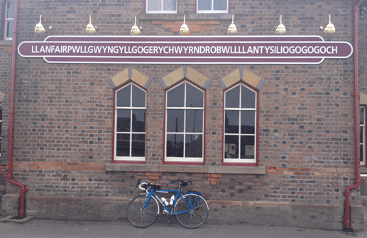 An audaxer's bike outside a Welsh railway station