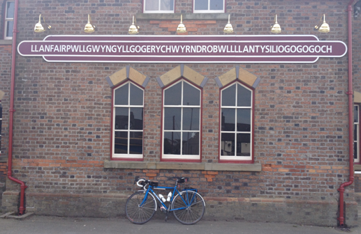 An audaxer's bike outside a Welsh railway station
